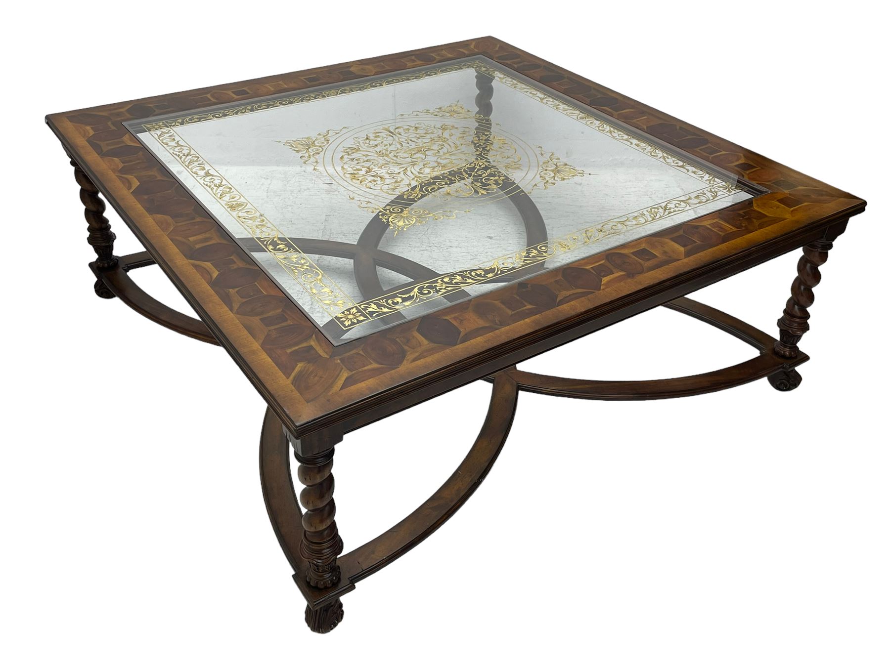 Jonathan Charles - large mahogany coffee table, the square oyster veneered top with verre églomisé inset, the glass hand-painted with gilt scrolling foliate patterns, raised on spiral turned supports with acanthus and gadroon carvings, united by interlocking demi-lune stretchers, on scrolled acanthus feet