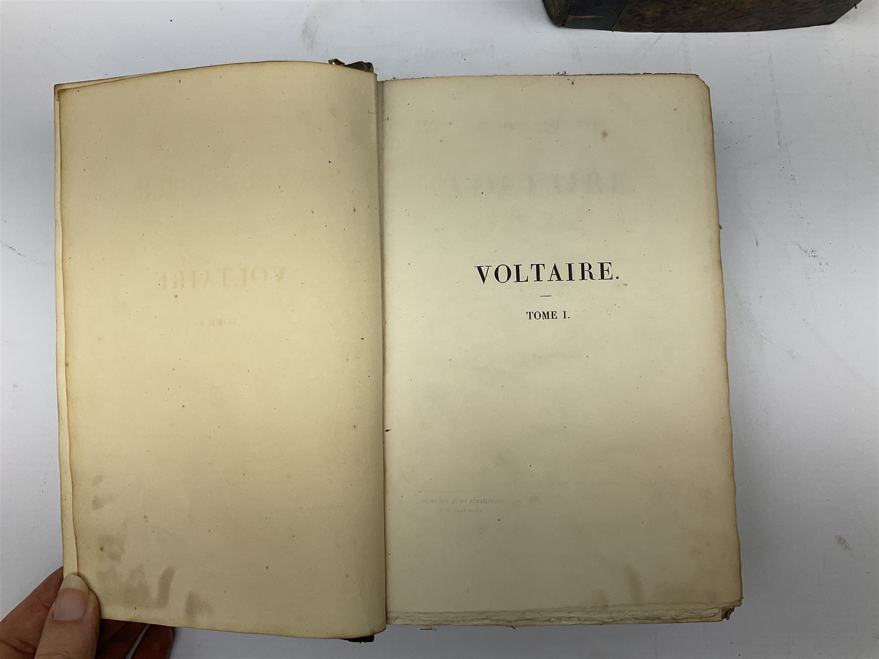 Eighteen 19th century leather bound books including Oeuvres Completes De Voltaire. 1827 Paris. Two volumes; Oeuvres De Pierre Corneille. 1892 Paris; Commentarium in Librum Geneseos Scripsit Thomas Josephus Lamy. 1883 Mechliniae; etc (18)