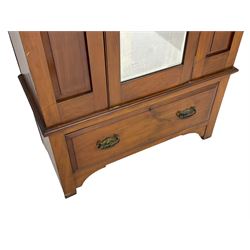 Edwardian walnut single wardrobe, projecting cornice over panelled front and bevelled mirror glazed door, single drawer to base