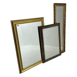 Narrow rectangular wall mirror in ornate gilt frame (42cm x 133cm), and two other wall mirrors