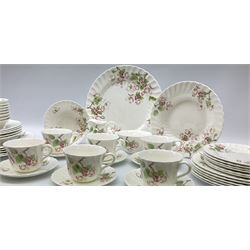 Wedgwood Apple Blossom pattern dinner and tea wares, comprising six dinner plates, six side plates, six bowls, nine smaller bowls, six tea cups and six saucers, milk jug and open sucrier. 