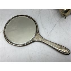 1920's silver mounted hand held dressing table mirror, with engine turned decoration, hallmarked Chester 1921, together with an Edwardian silver cream jug, hallmarked London 1905, approximate weighable silver 1.90 ozt (59.2 grams)