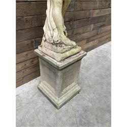 Cast stone garden figure of a bathing lady, raised on square plinth