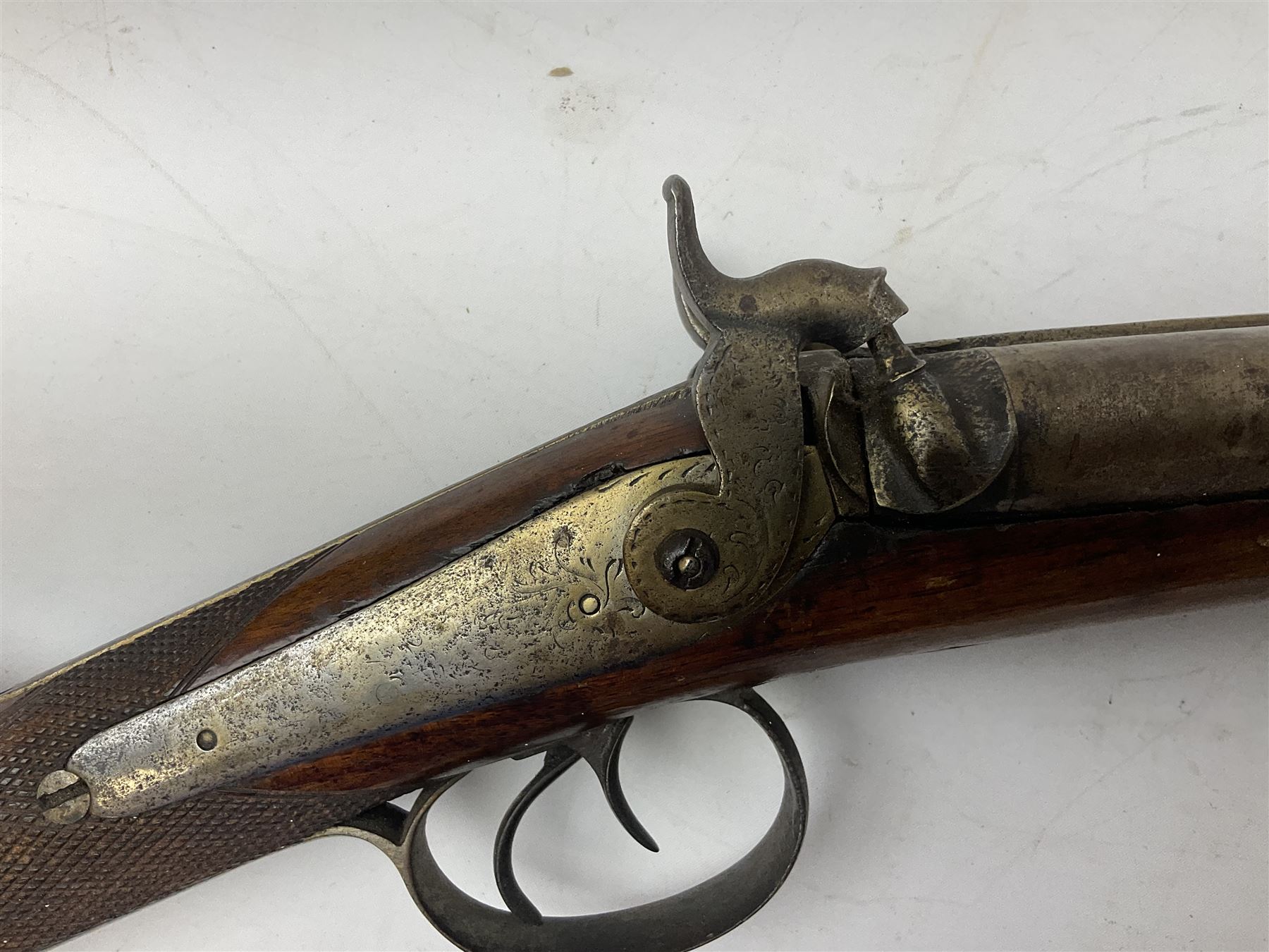 19th century 13-bore double barrel side-by-side percussion cap shotgun, the 72cm stub twist damascus barrels with ramrod under, walnut stock with chequered grip L117.5cm overall
