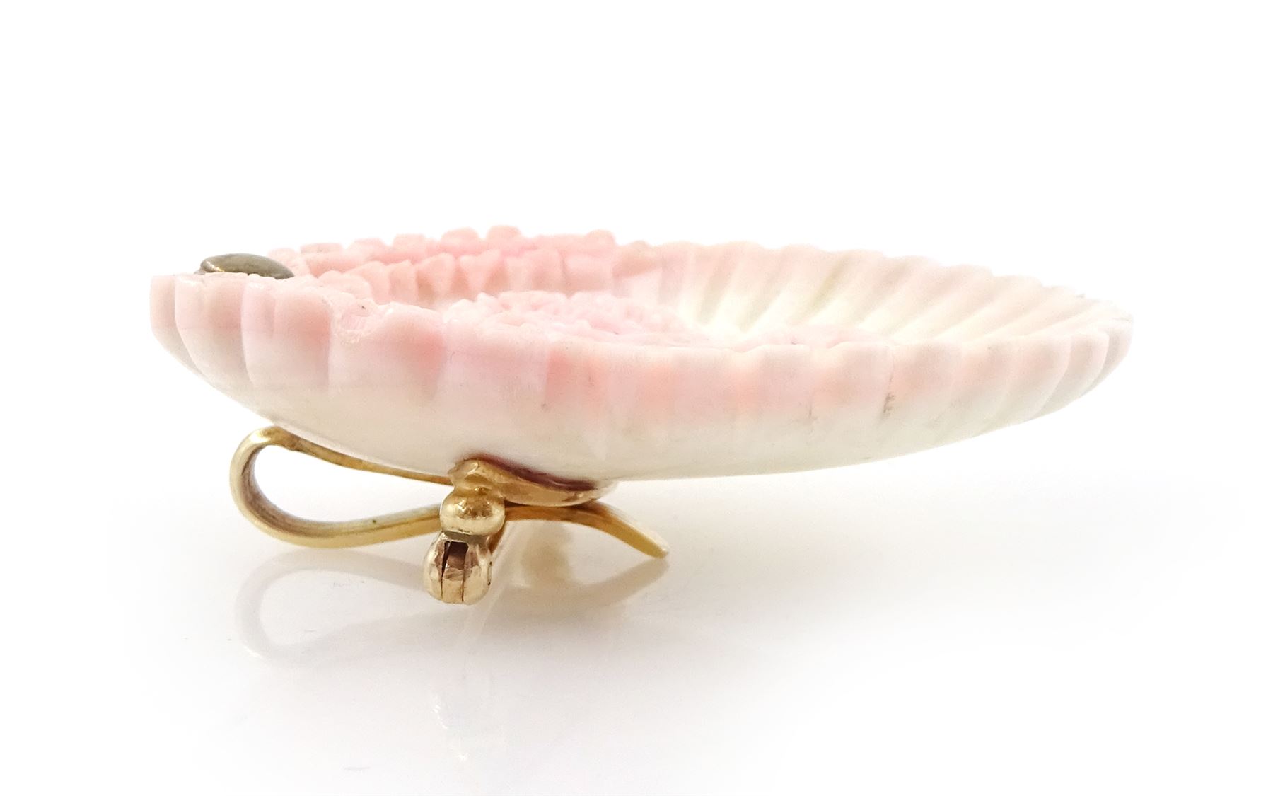 19th century gold conch shell pendant / brooch and matching earrings, each with carved bust shell of a cherub / child and flower head decoration, the earrings suspending a further flower head stud