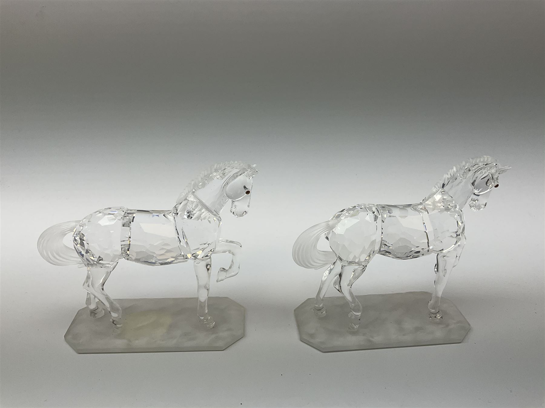 A pair of Swarovski Crystal horses H9.5cm, in original boxes