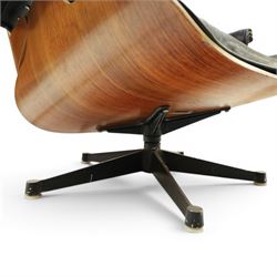 Charles and Ray Eames for Herman Miller - lounge chair, moulded veneered plywood shell with buttoned black leather upholstery, separate headrest and back cushions, padded armrests, on black cast aluminium five-star swivel base, manufactured under licence by Hille of London