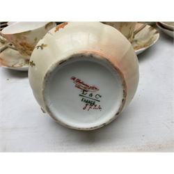 Early 20th century Limoges part tea service, decorated with floral sprays and gilt on merging peach and white ground, comprising six teacups, twelve side plates, six smaller plates, milk jug, open sucrier, slop bowl and two cake plates, many marked R Delinieres Limoges D&C France to base