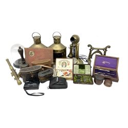 An assortment of mixed decorative items including a reproduction candle stick phone, ships navigation lights, binoculars, cameras etc.