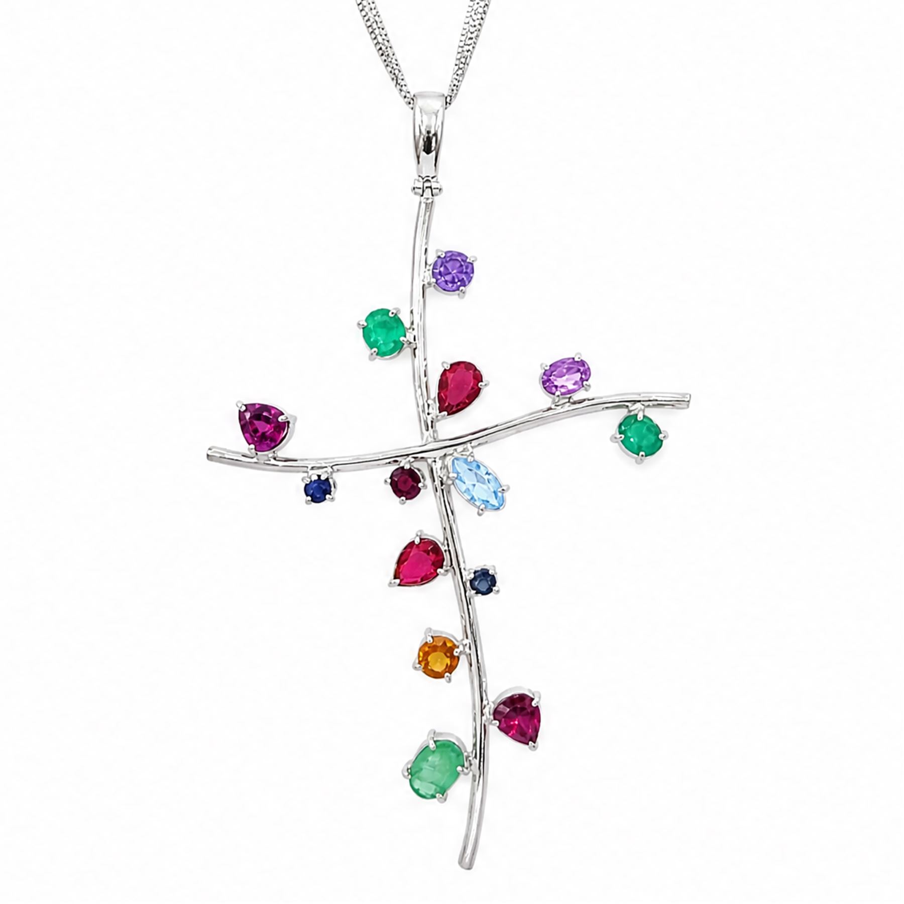18ct white gold multi gemstone cross pendant necklace, vari-cut stones including emerald, ruby, pink and blue sapphire, red and blue stones, on a four strand box link chain necklace, stamped 750