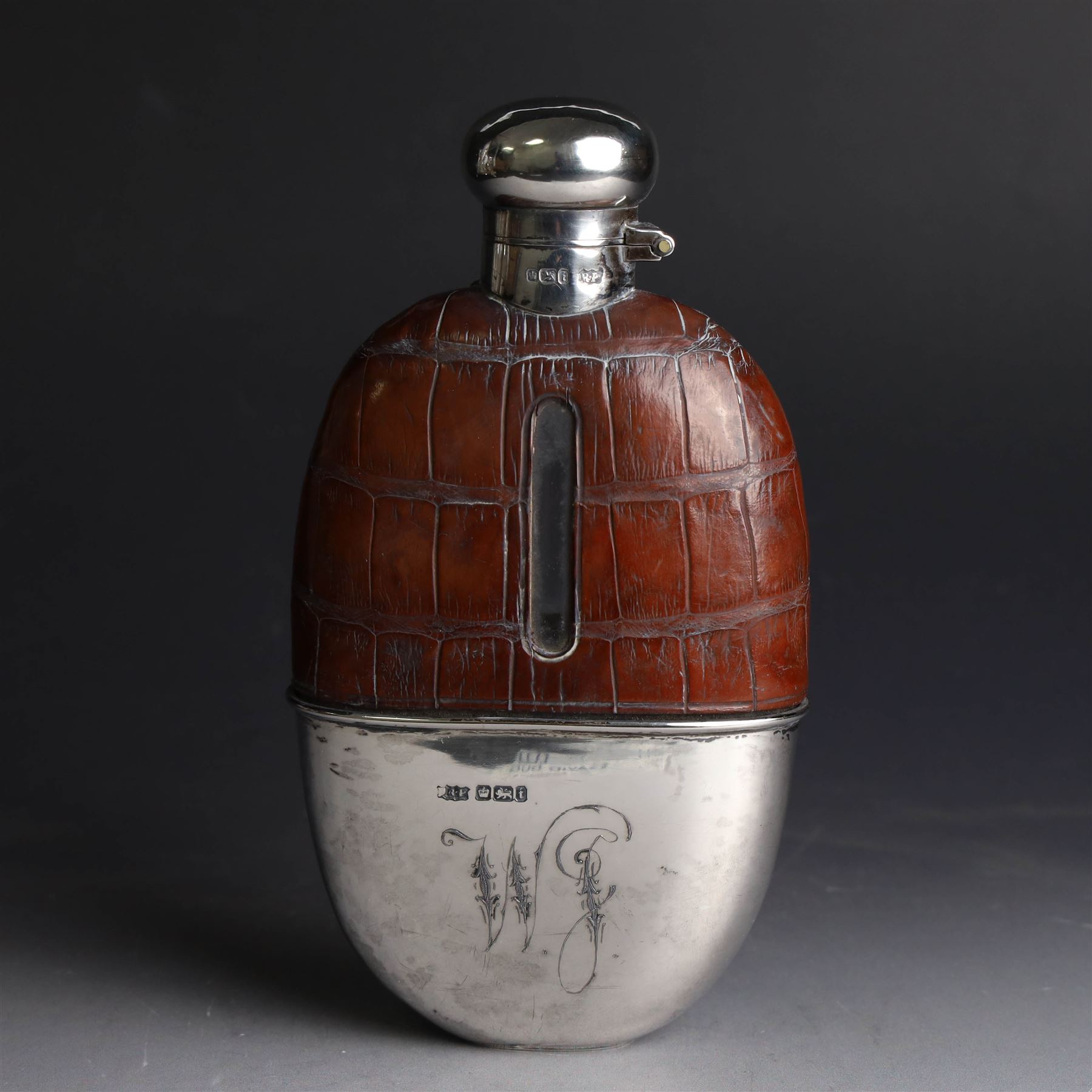 Edwardian hip flask, the glass body with leather cover,  removable silver cup and silver cap, the cup engraved with monogram, hallmarked Robert Pringle & Sons, Sheffield 1901, H15cm