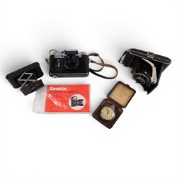 Three cameras, including Kodak Vest Pocket Camera A-127, Zenit E and a Hapo 10 and a Smith...