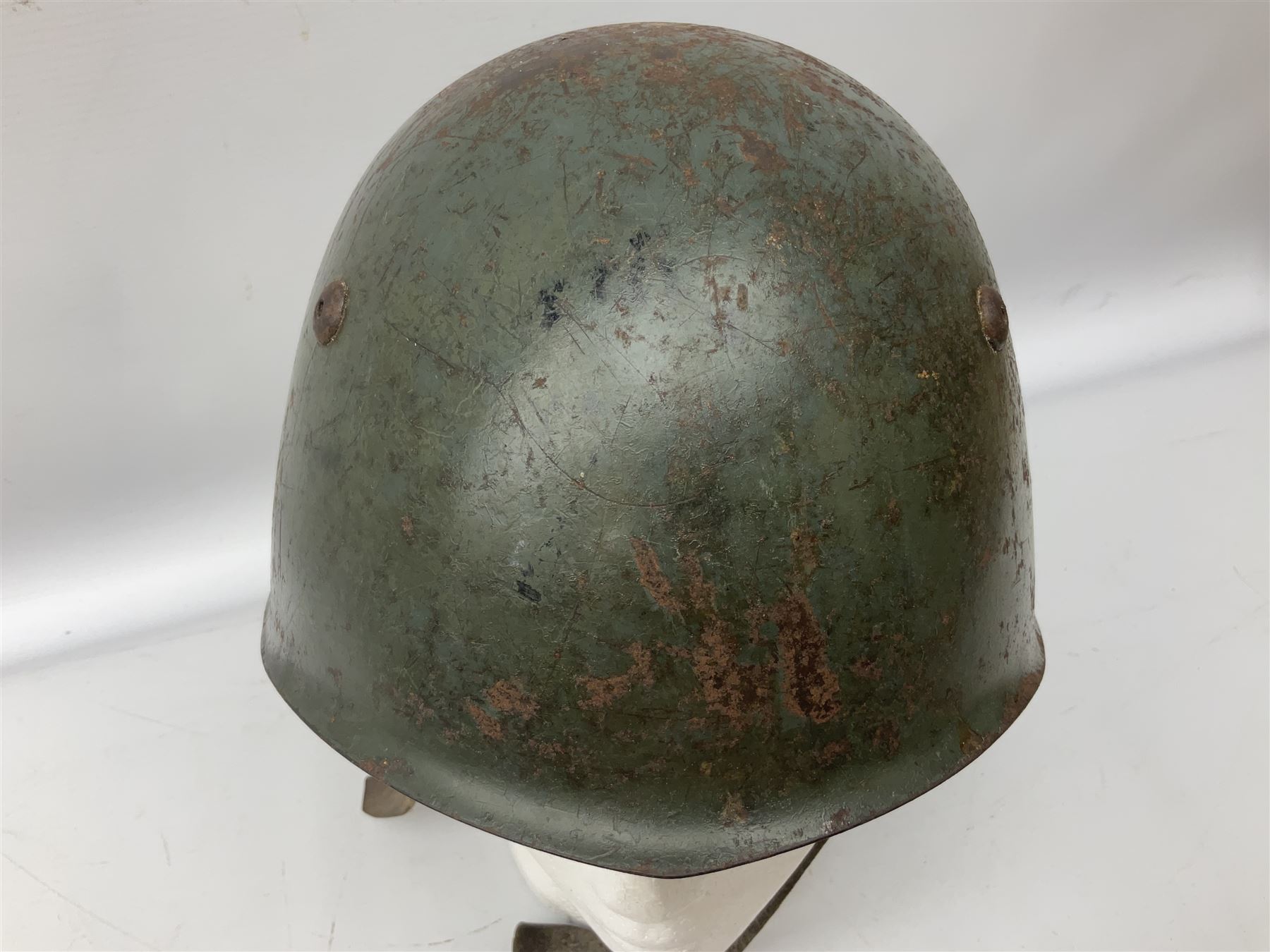 WWII Italian steel helmet with liner and chin strap