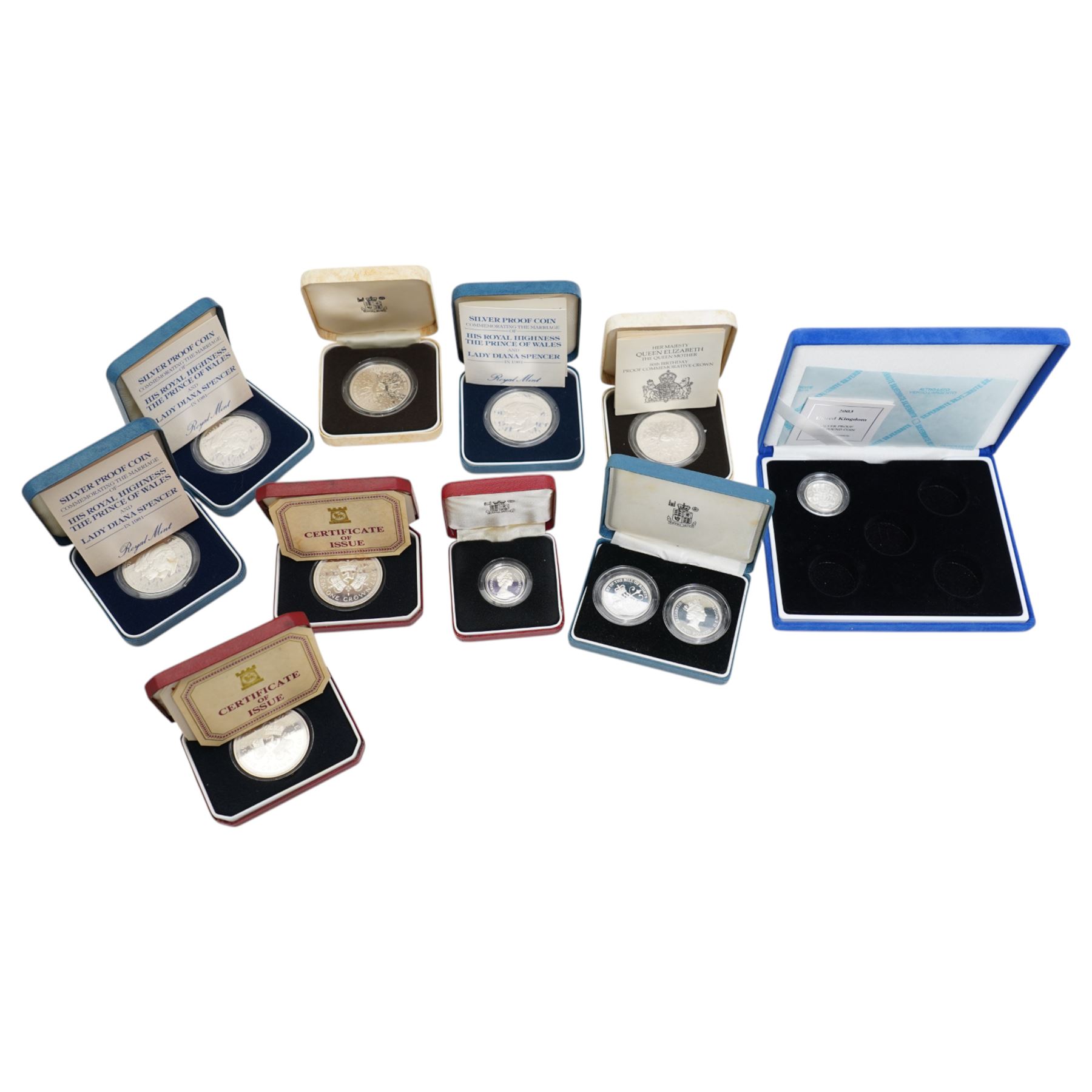 Eight The Royal Mint United Kingdom silver proof coins, comprising 1980 crown (2), 1981 crown (3), 1983 one pound, 1989 two pound two coin set, 2003 one pound, mostly cased with certificates, together with two Isle of Man 1977 silver proof crown coins issued by the Pobjoy Mint