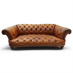 Tetrad - 'Oskar' grande three-seat sofa, Chesterfield shape with rolled arms over serpentine back and front, upholstered in fully buttoned tan leather, raised on reed-moulded feet of globular form