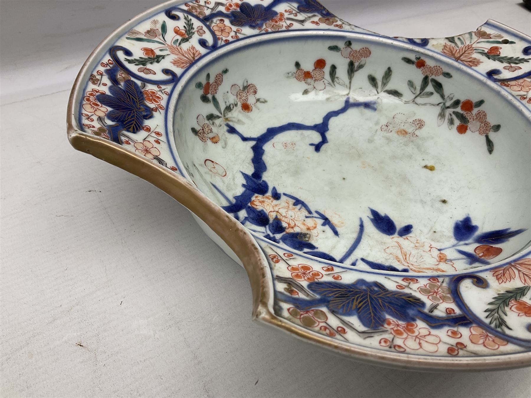 19th Century Imari pattern Japanese blood letting bowl, together with 19th century chinese blue and white square dish with decorated with blossoming flowers, together with thee blue and white saucers 