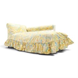 Victorian chaise longue in chintz upholstery, scrolled back with turned spindles up, raised on castors