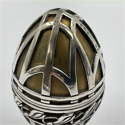 Modern silver limited edition Easter egg, no. 70/500, the gilded body decorated in relief with silver latticework and a band of flower heads, the detachable cover opening to reveal a gilt interior, each hallmarked St James House Company, London 1978, H5.5cm