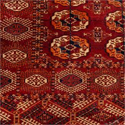 Vintage Bokhara hand-knotted rug, madder field woven in rows of octagonal Tekke guls arranged in vertical columns, each enclosing angular cruciform devices and tribal motifs, divided by narrow indigo lines, within multiple geometric borders incorporating stepped lozenges and latch hook devices, with cotton fringe ends 