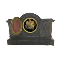 French - late 19th century 8-day mantle clock with garnitures in a break front Belgium slate case, with a break arch top and ornamental brass relief in the form of cherubs representing music and literature, on a deep plinth with padded feet, two part gilt dial with a pierced  filigree centre and Arabic numerals, rack striking movement, striking the hours and half hours on a coiled gong, with matching garnitures in the  form of urns on a raised plinth. With pendulum and key.  
