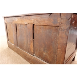  18th century oak coffer, with hinged planked top above scroll carved frieze and four raised and fielded panels, W128cm, D55cm, H65cm   