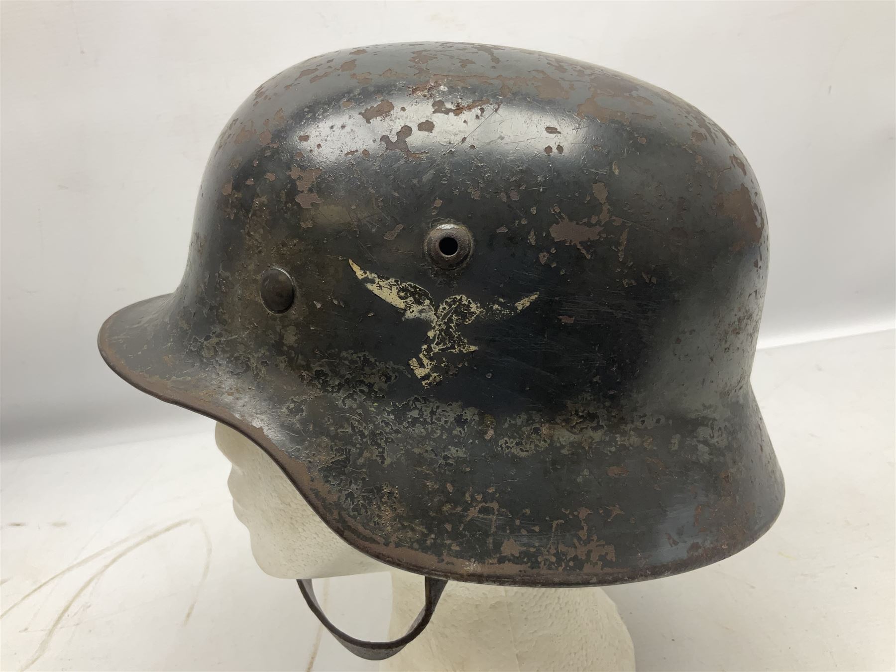 WW2 German Luftwaffe M40 double decal steel helmet with liner and chin strap; impressed 506 to back skirt; indistinct stencil type name(?) to inside