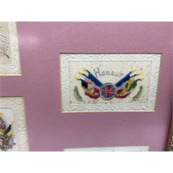 Thirty-five WW1 embroidered silk postcards including regimental crests, flags of the Allies, envelope type with greeting card inserts, Christmas and birthday cards etc; mounted and glazed in three graduated modern matching gilt frames (3)