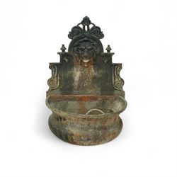 Victorian cast iron ‘lavabo’ lion's head wall fountain, the arched and crested backplate c...
