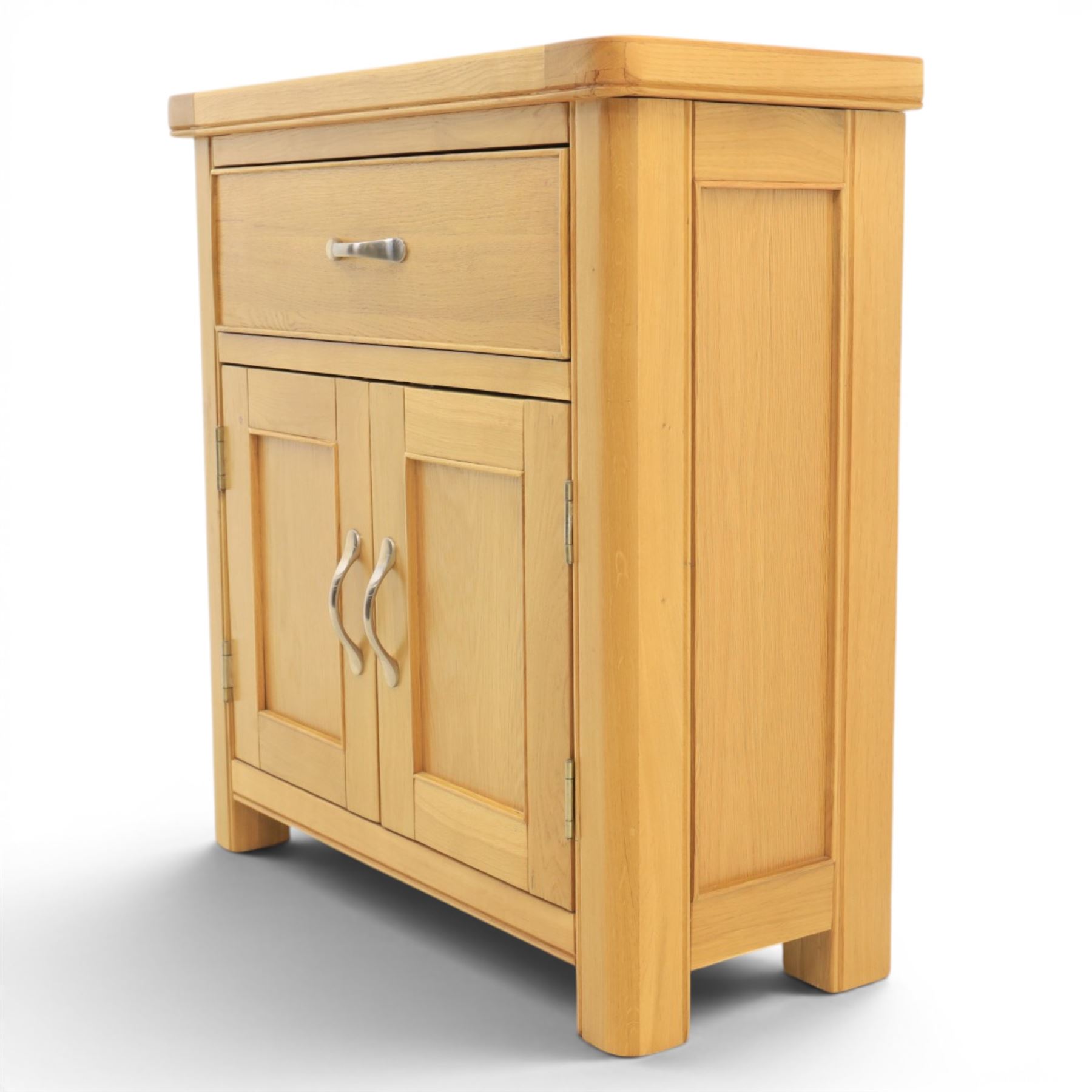 Modern oak living room set comprising; a small side cabinet, corner TV stand and coffee table, cabinet with single drawer and cabinet, finished with metal handles (H 80cm, D 32cm, W 80cm), TV stand with open recess and rear aperture for wires, above nine drawers with chrome pulls (H 62cm, D 50cm, W 84cm)  coffee table with curved edges and full length undertier (H 50cm, D 60cm, W 90cm)  