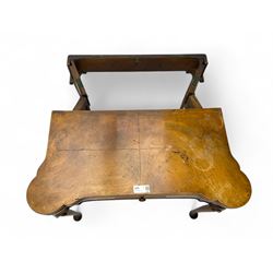 Georgian walnut fold-over card table, shaped rectangular top opening to reveal a baize-lined surface, supported by a concertina pull-out rear mechanism, frieze fitted with single drawer, raised on cabriole supports with foliate carvings terminating in pad feet