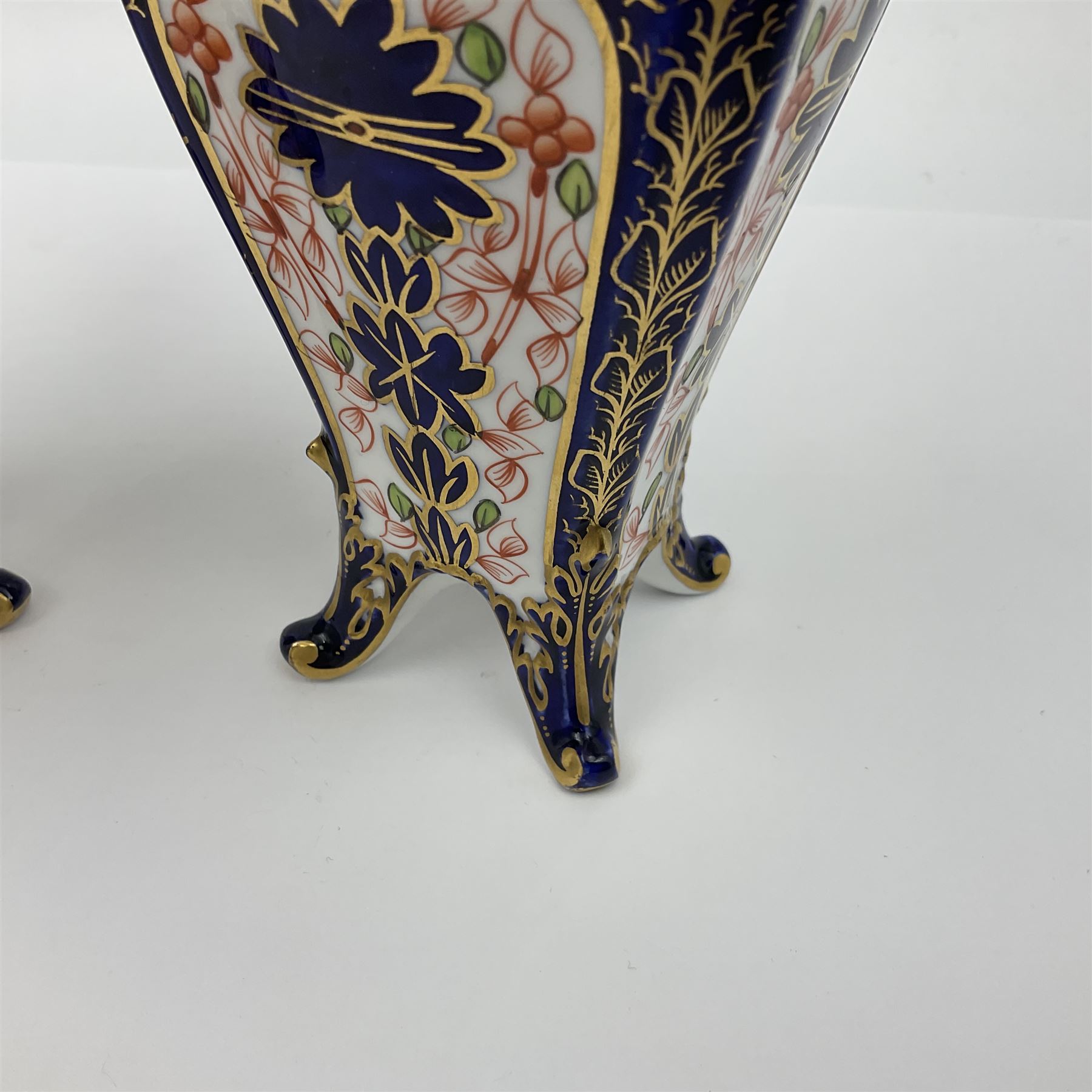 Pair of early 20th century Royal Crown Derby Imari 1128 pattern vases, of tapering straight sided form with waisted neck and frilled rim, upon four splayed feet, with printed and painted marks beneath including illustration date codes for 1911 and 1920, H17cm