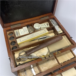  Dentistry - Late Victorian mahogany Dentists cabinet by C. Ash & Co, hinged cover above six long graduated drawers, enclosing a comprehensive arrangement of implements, pharmaceutical bottles, tools, modelling wax, porcelain teeth, 