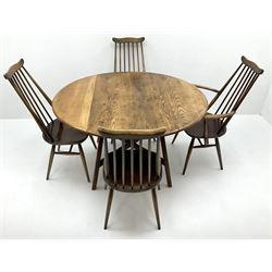 Ercol medium elm drop leaf table (W125cm, H72cm, D114cm and four stick back chairs (W63)
