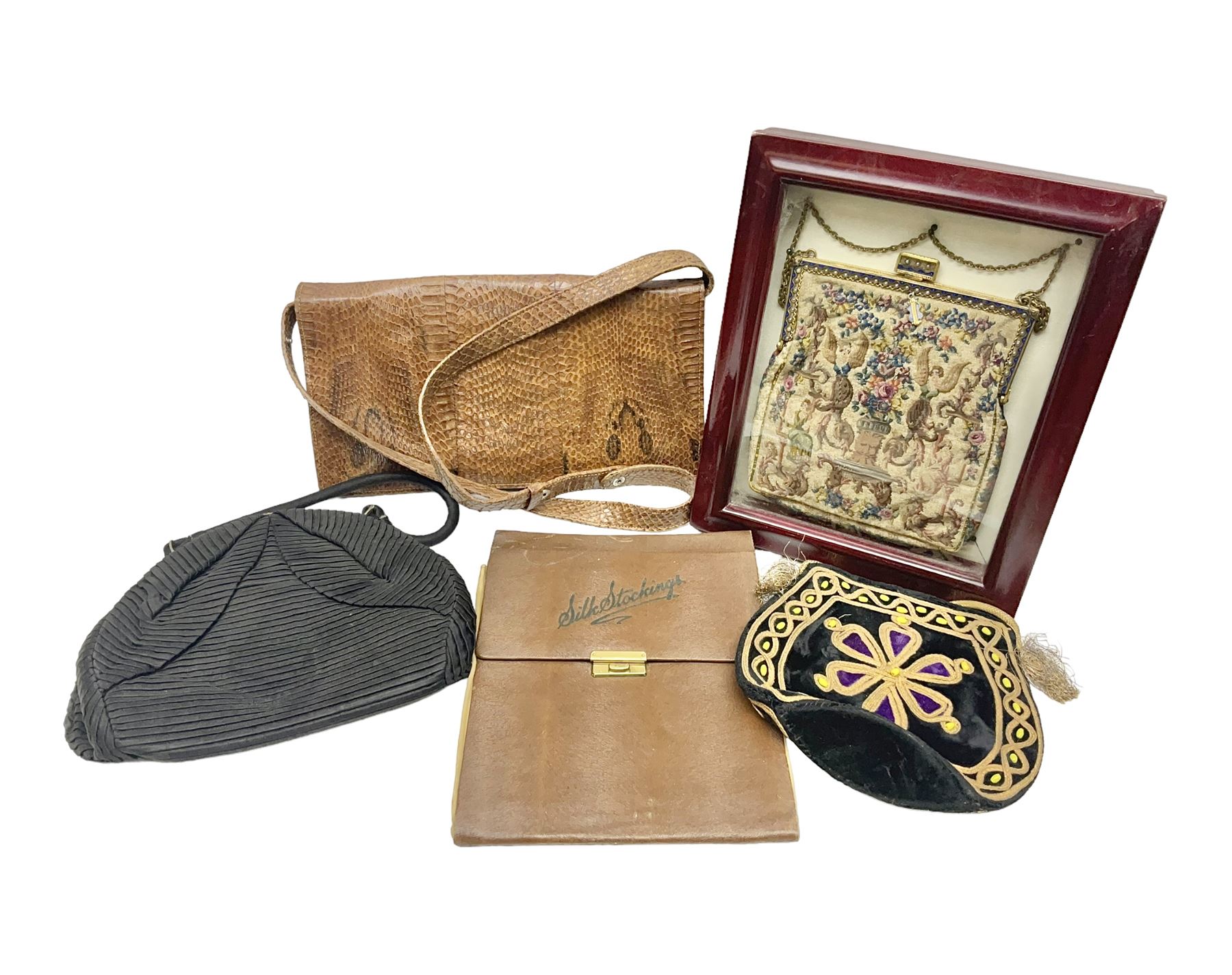 Continental petit point evening bag, with enamel and pearl details, in wooden display frame, together with a snake skin handbag and three other vintage bags