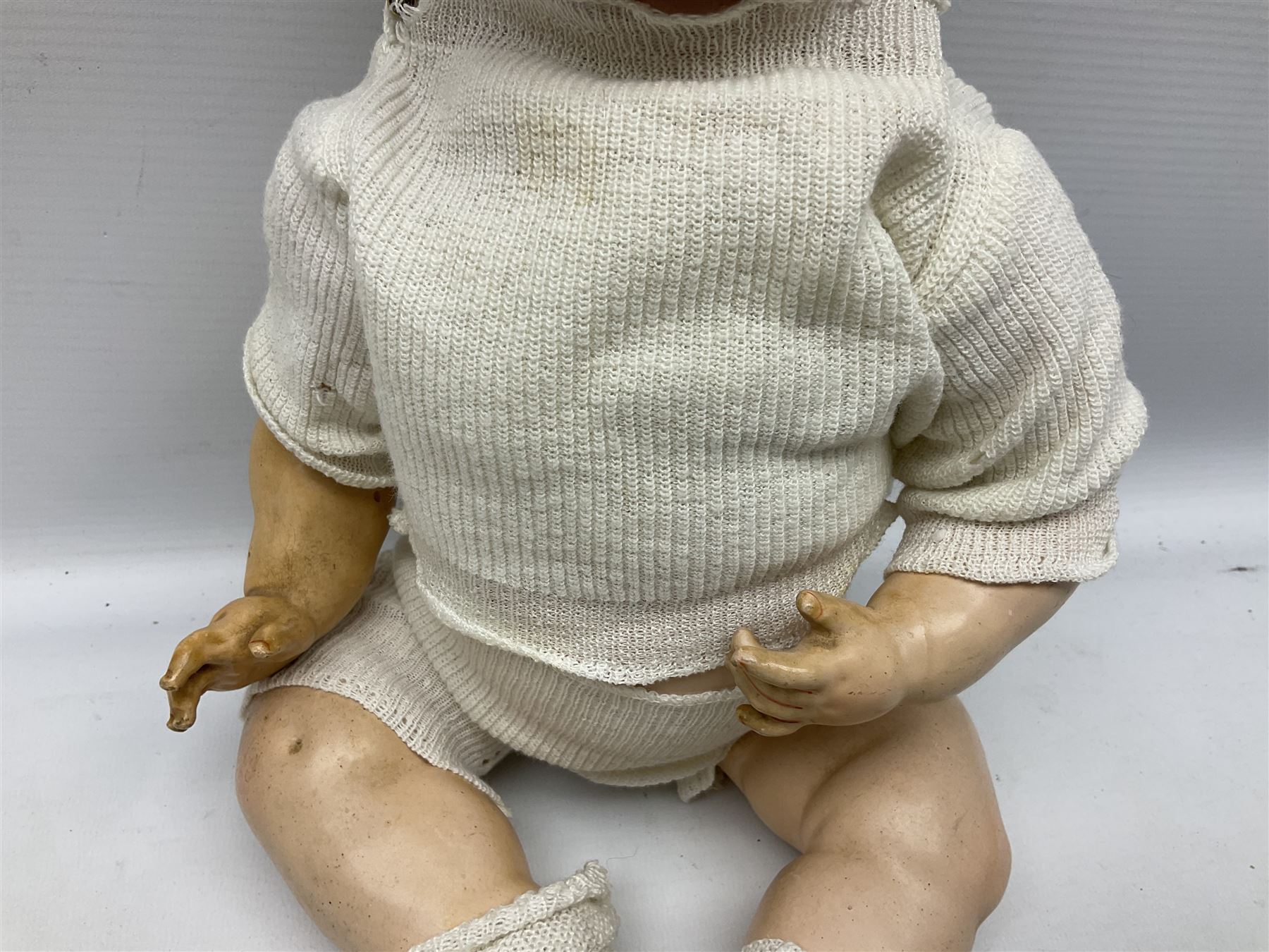 Carl Harmus Germany bisque head doll with applied hair, sleeping eyes, open mouth with teeth and composition body with jointed limbs; marked 'Harmus 313.4/0 Germany' H38cm; and Alt, Beck & Gottschalk Germany bisque head doll with applied hair, fixed eyes, open mouth with tongue and composition body with jointed limbs H44cm (2)