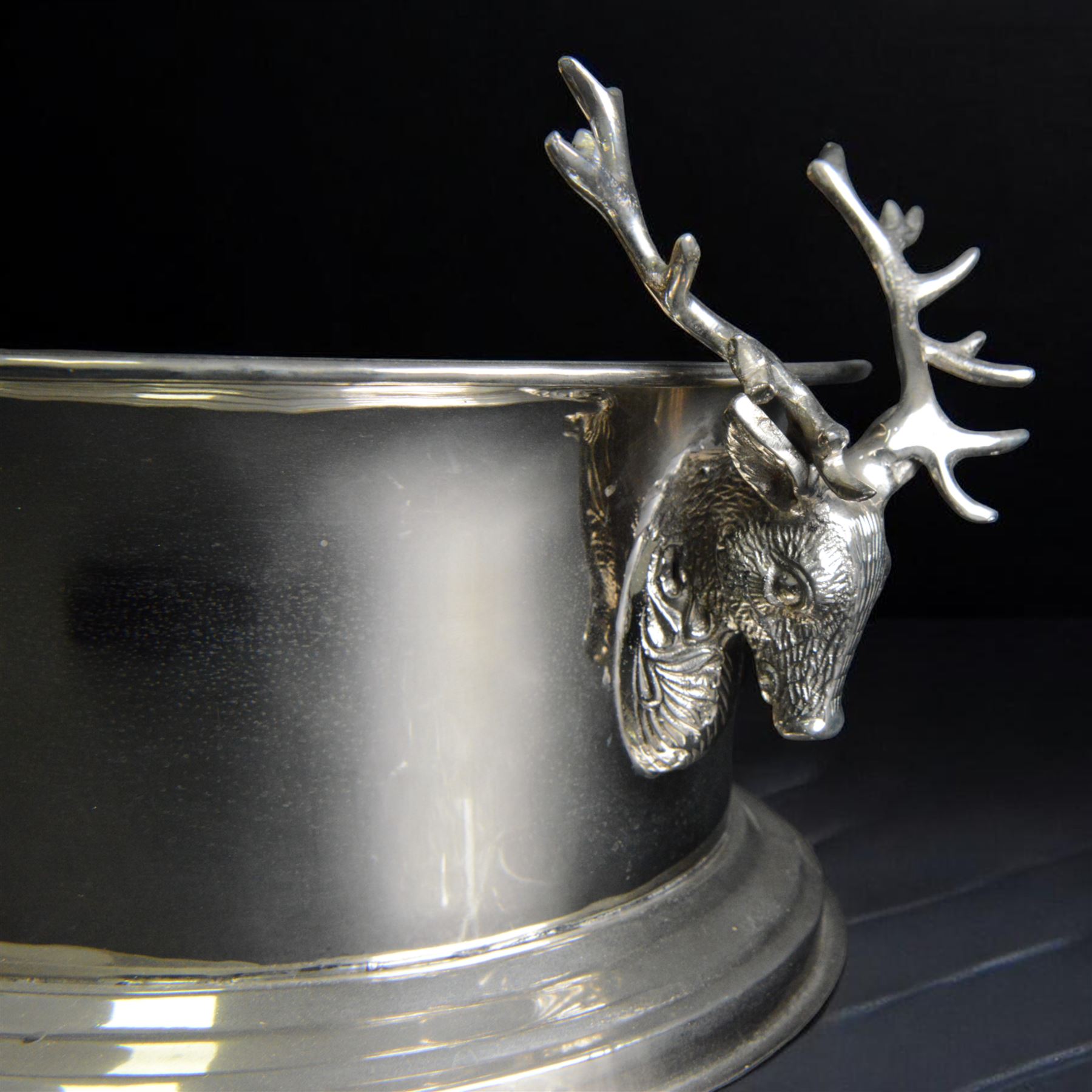 Large oval silver plated champagne cooler, with stag handled, upon a stepped base, H16cm, L38cm