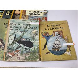Twenty one first edition Herge, 'The Adventures of Tin Tin' books published by Casterman Bruxelles, with French text and coloured comic strip illustrations throughout; comprising Tintin Au Congo 1946, Tintin En Amerique 1946, Les Cigares du Pharaon 1955, Le Lotus Bleu 1946, L'Oreille Cassee 1943, L'ile Noire 1943, Le Sceptre d O'ttokar 1947, Le Crabe Aux Pinces D'or 1943, L'Etoile Mysterieuse 1942, Le Secret de la Licorne 1943, Le Tresors de Rackan Le Rouge 1945, Les 7 Boules de Cristal 1948, Le Temple du Soleil 1949, Au Pays de L'Or Noir 1950, Objectif Lune 1953, On a Marche sur la Lune 1954, L'Affaire Tournesol 1956, Coke en Stock 1958, Tintin au Tibet 1960, Les Bijous de la Castafiore 1963 and Vol 714 Pour Sydney 1968
