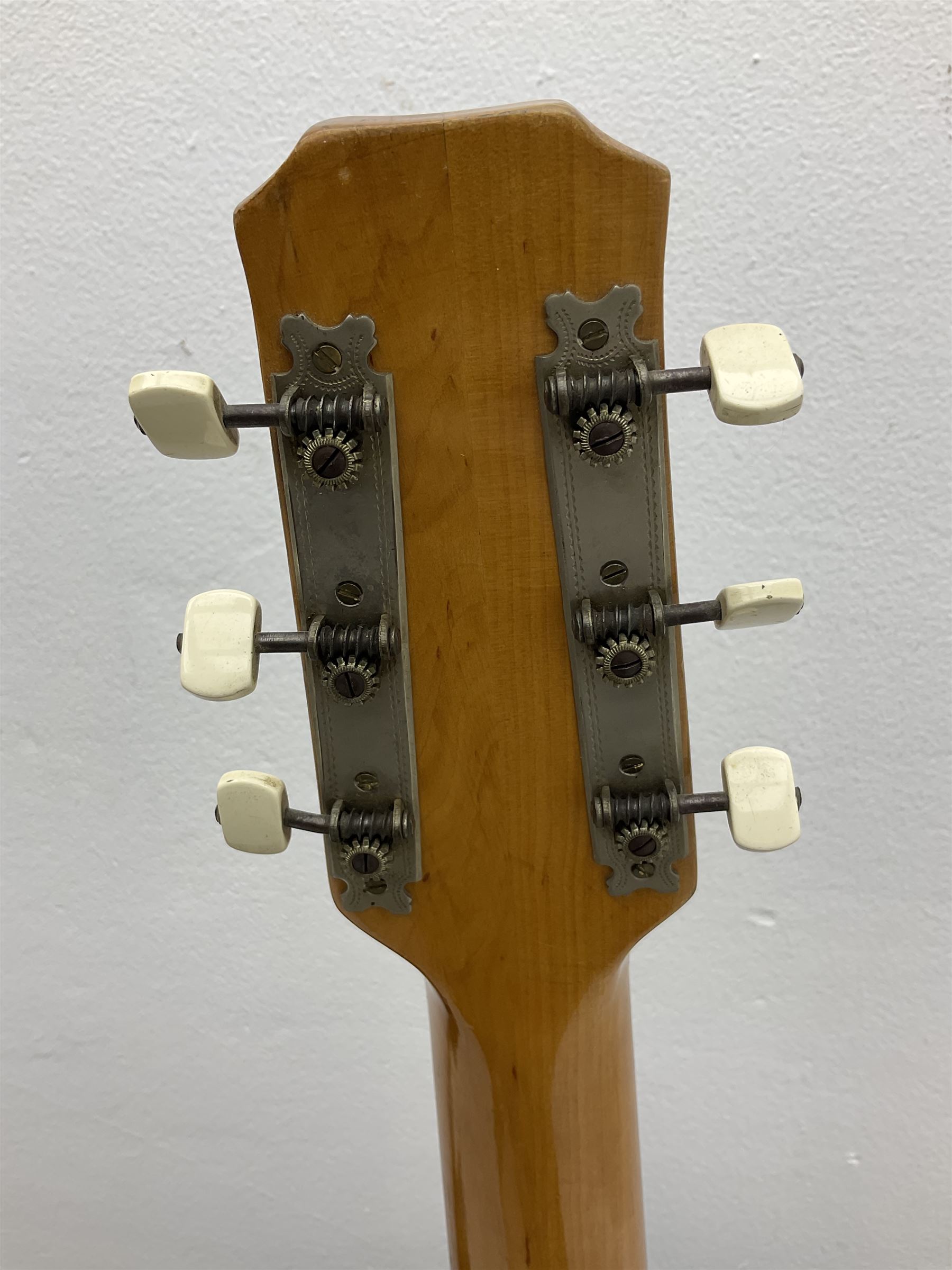 1950s acoustic guitar with f-holes and pickguard L105cm; black fur lined hard carrying case
