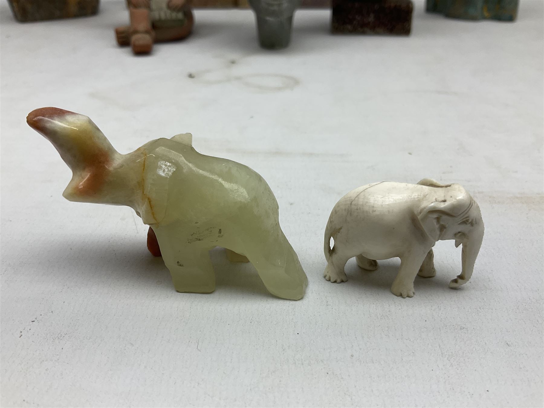 Pair of soapstone figural bookends carved with elephants, African soapstone bust, Buddha bust, Egyptian style etc, tallest H18cm