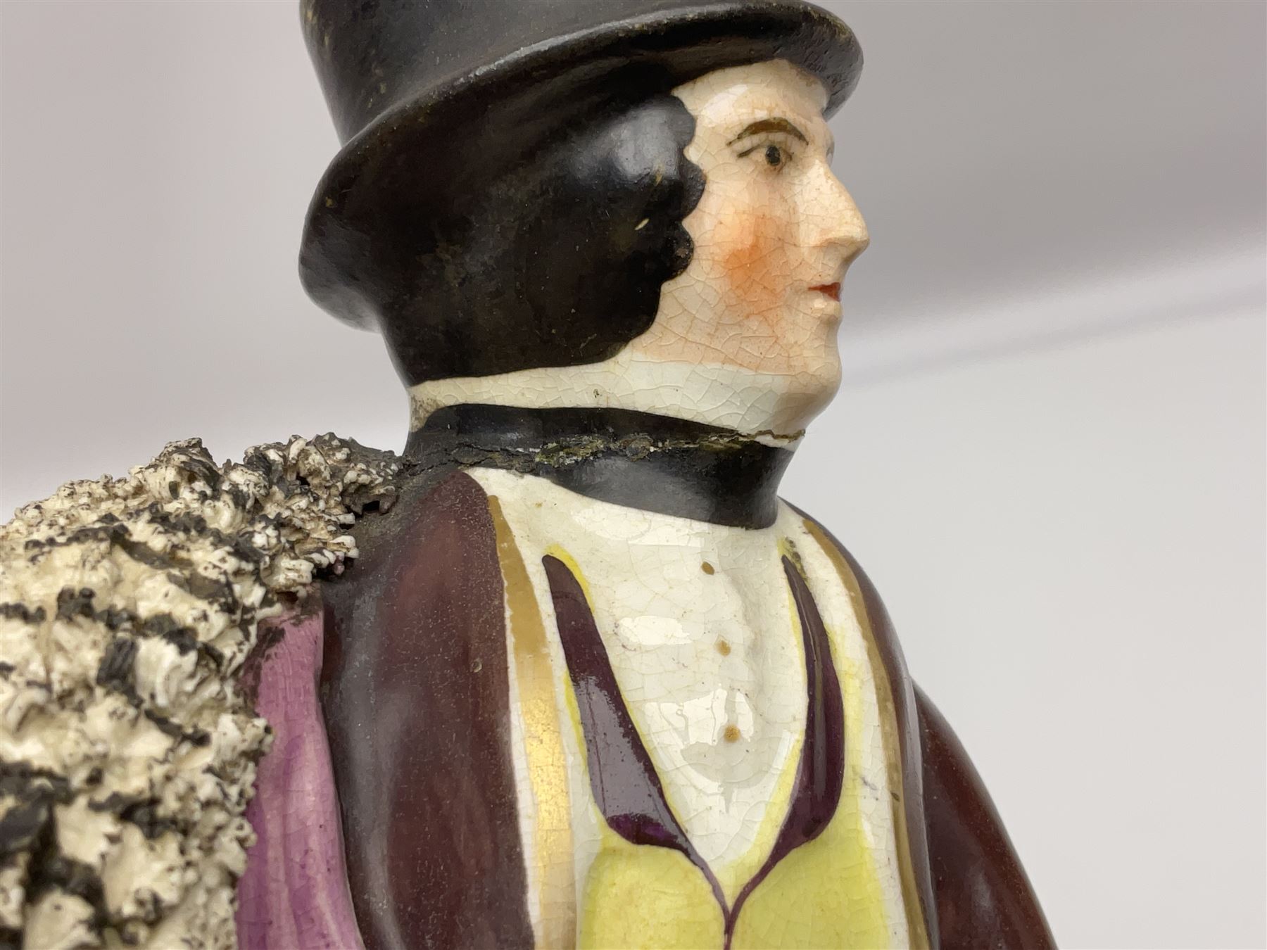 19th century Staffordshire figure of Robert Peel, titled 'Sir Robert Peel', modelled on horseback, atop an oval plinth base featuring a naturalistic and floral design, H30cm 