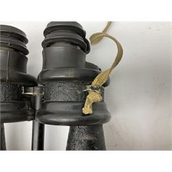 Pair of WWII German U-boat binoculars probably 7 x 50 by Leitz, with rubber eye piece protector covers and leather case stamped with Kriegsmarine mark to the lid and dated 1944, with leather strap.