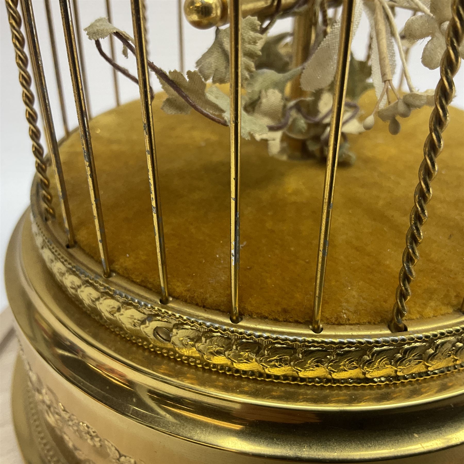Swiss Reuge Music bird cage automaton music box, the bird with articulated head and beak, in a gilt brass cage, with a glass dome and stand, H30cm