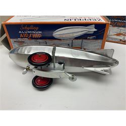 Schylling - six tinplate models comprising Sir Ian’s Bluebird racing car, Speedway Auto Racer, two Aluminium Airships, Tin Speedboat and Ernest in the Music Box; all in original boxes 