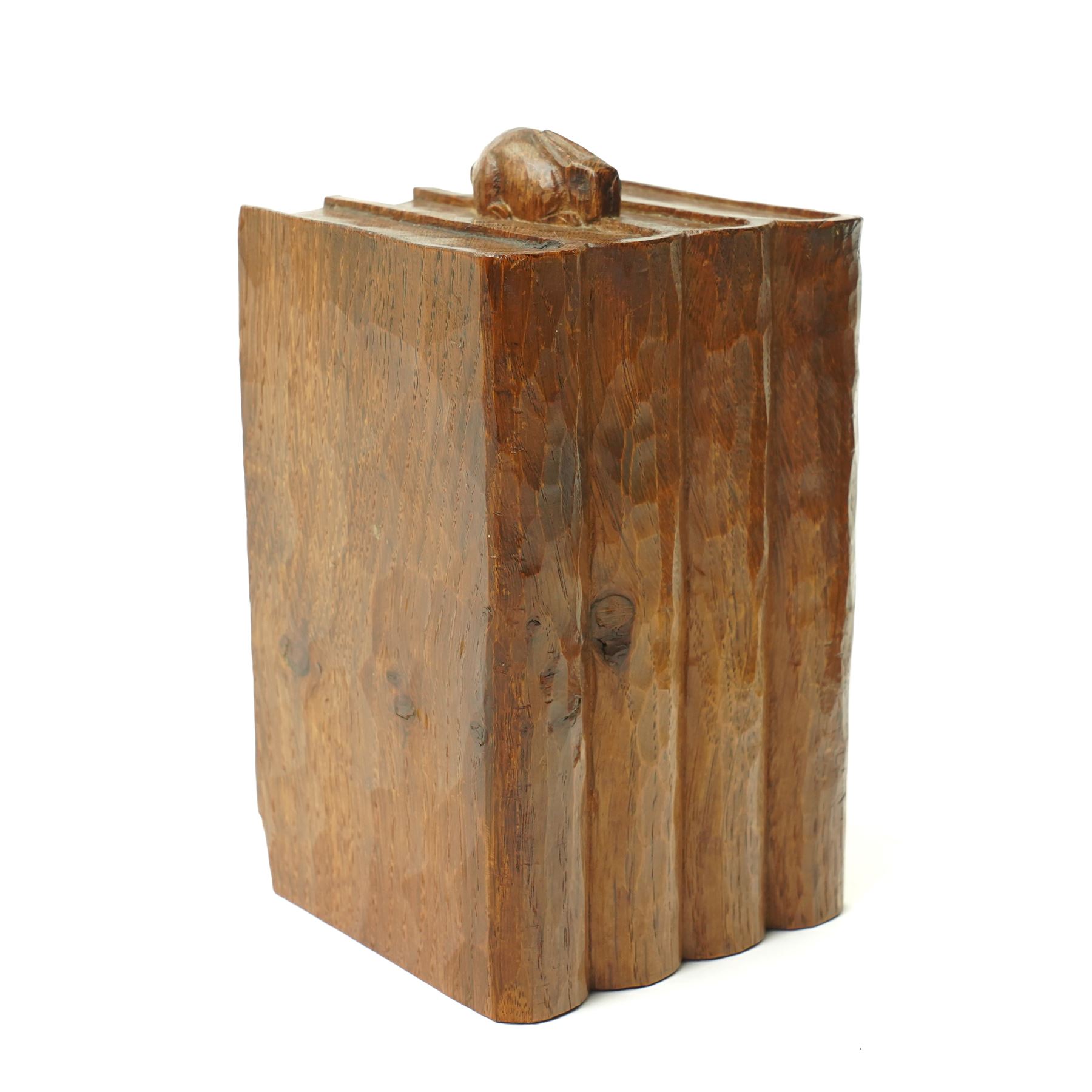 Rabbitman - pair of adzed oak bookends, each carved as a set of four books, with carved rabbit signature, by Peter Heap of Wetwang