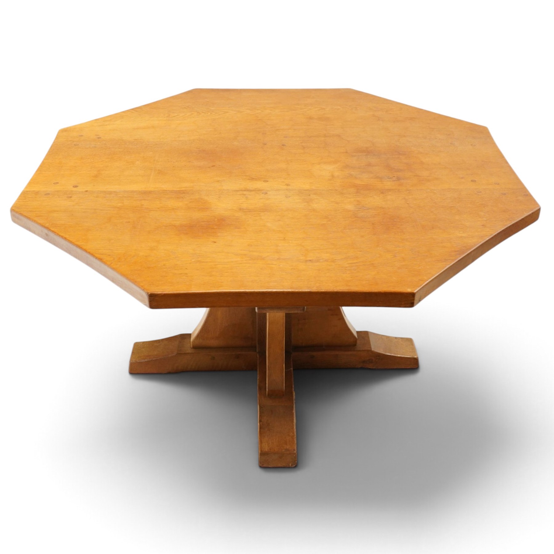 Mouseman - 1940s pre-war adzed oak octagonal dining table, the octagonal adzed top with concave sides, raised on a cruciform base with sledge feet, with carved mouse signature, by the workshop of Robert Thompson of Kilburn

Provenance: ordered directly from the Mouseman workshop in the 1940s before the outbreak of the war, the items were subsequently delivered after the end of war. 