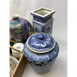 A group of assorted Oriental and Oriental style ceramics, to include a blue and white ginger jar and cover, a blue and white vase of square sided form, plus a selection of other vases, jars, tea bowls, plates, etc. 