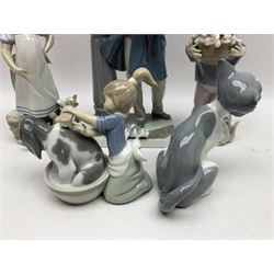Five Lladro figures, including The Lamp Lighter no 5205,  Girl and Kittens no 6102, Cat no 5113 etc