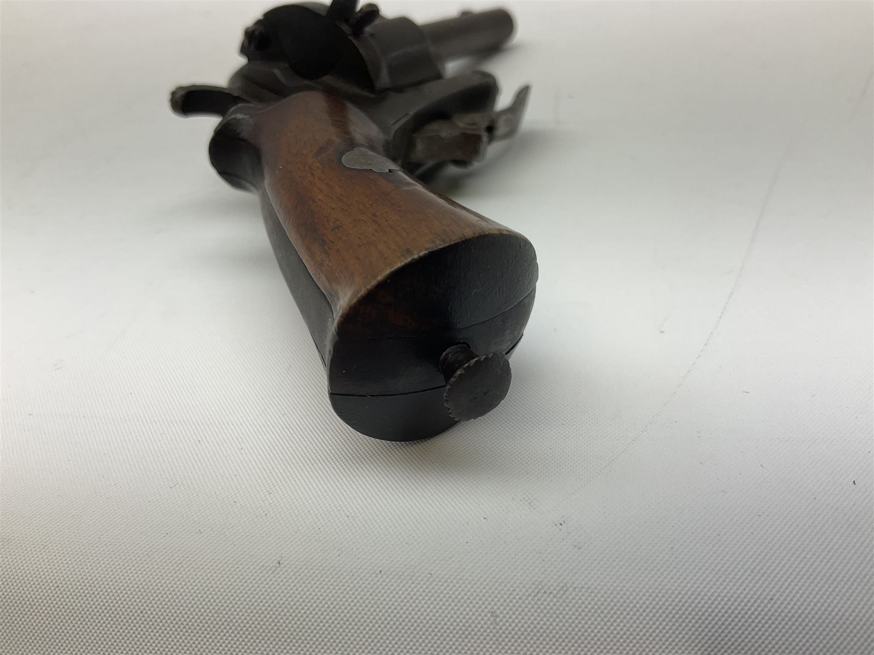 19th century Belgian Flobert 7mm pin-fire revolver with six-shot cylinder, 7cm octagonal to round barrel, folding trigger and walnut stock incorporating ejector rod in butt L18cm overall