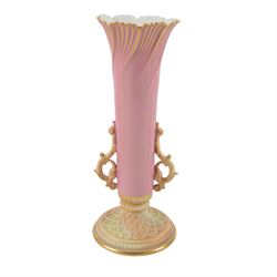 Royal Worcester Blush Ivory, comprising reticulated pot pourri jar upon eagle support, with black printed mark beneath, twin handled posy vase, shape no. 1556 with pink fluted body and puce mark beneath and three jugs, including shape no. 1018 example with bird mounted handle and two shape 1094 examples, all decorated with floral sprigs and with puce marks beneath, tallest H21cmn