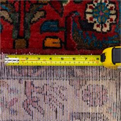 North West Persian Mahal hand-knotted runner, deep red ground, with a vertical arrangement of angular floral and geometric motifs, enclosed by an ivory border  of stylized leaves and rosettes, with guard stripes on indigo ground, cotton fringe ends 